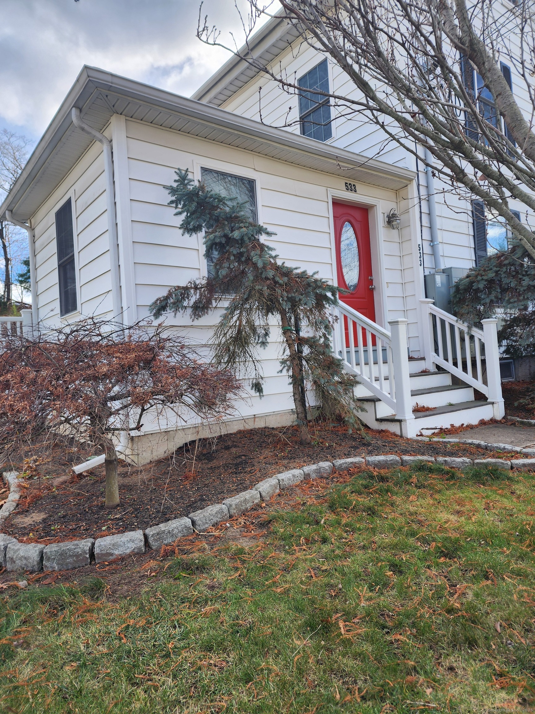 a front view of a house with a yard