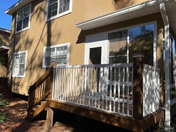 a view of balcony with furniture and wooden floor