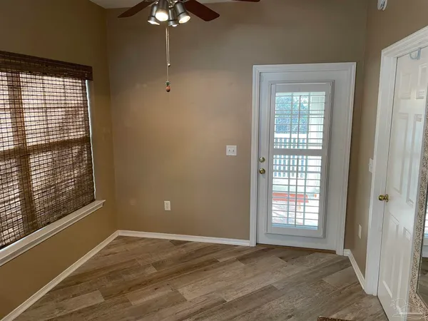 a view of an empty room with a window
