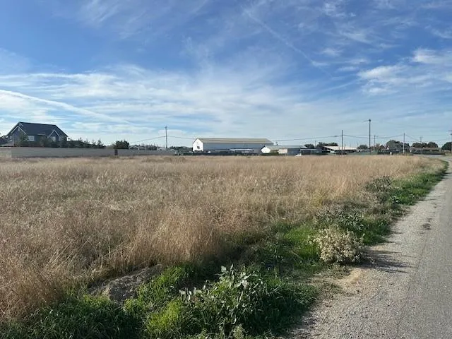 a view of a lake with houses in the back
