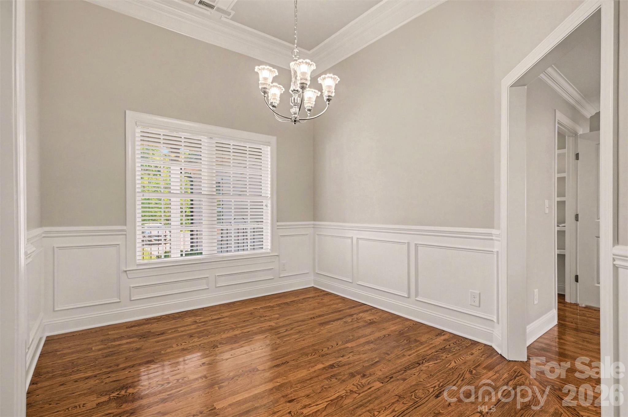 3604 Rilla Hamilton Road Monroe, NC 28110 - Photo 12 of 46 a view of an empty room with wooden floor and a window