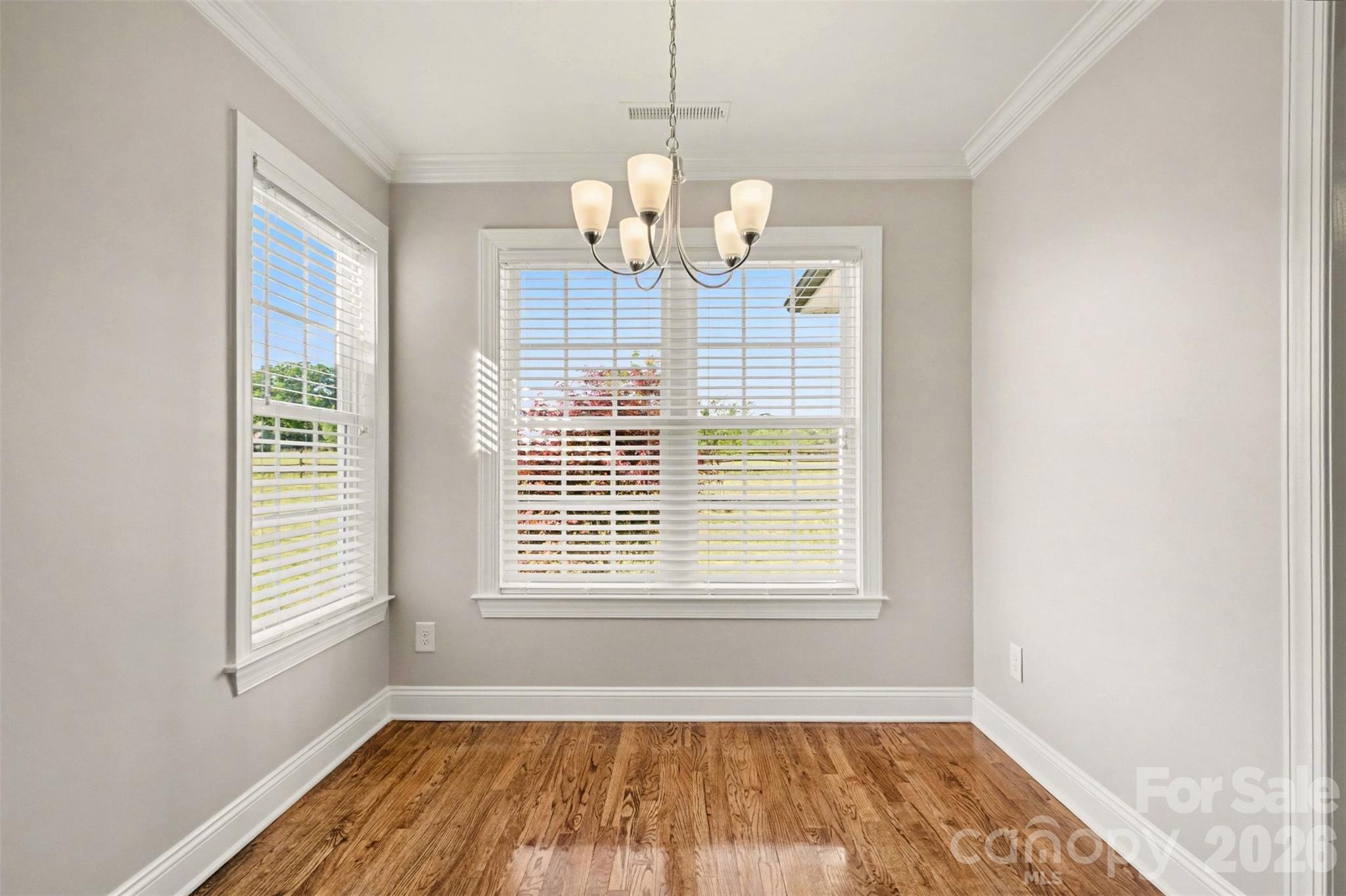 3604 Rilla Hamilton Road Monroe, NC 28110 - Photo 17 of 46 a view of empty room with wooden floor and fan