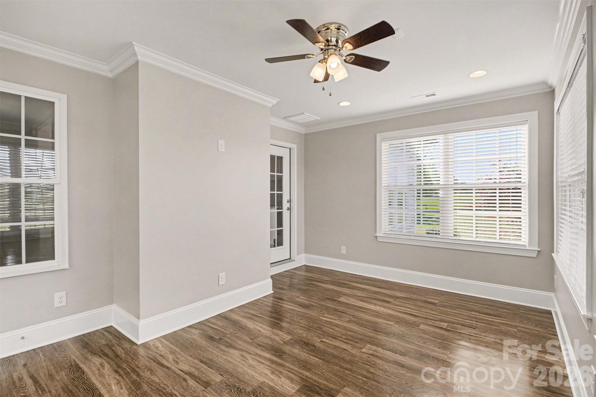 3604 Rilla Hamilton Road Monroe, NC 28110 - Photo 23 of 46 an empty room with wooden floor and windows