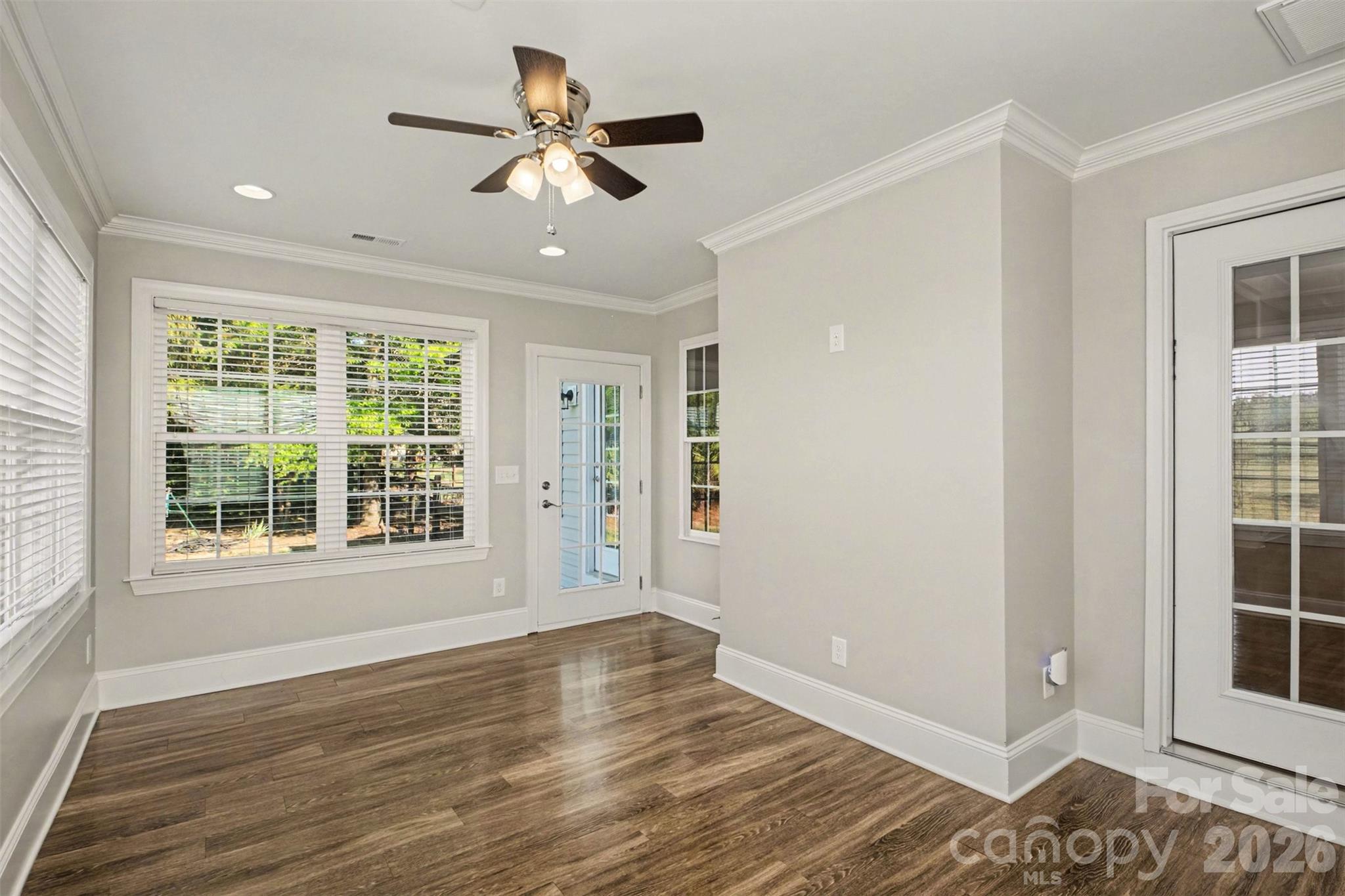 3604 Rilla Hamilton Road Monroe, NC 28110 - Photo 24 of 46 a view of an empty room with a window and wooden floor