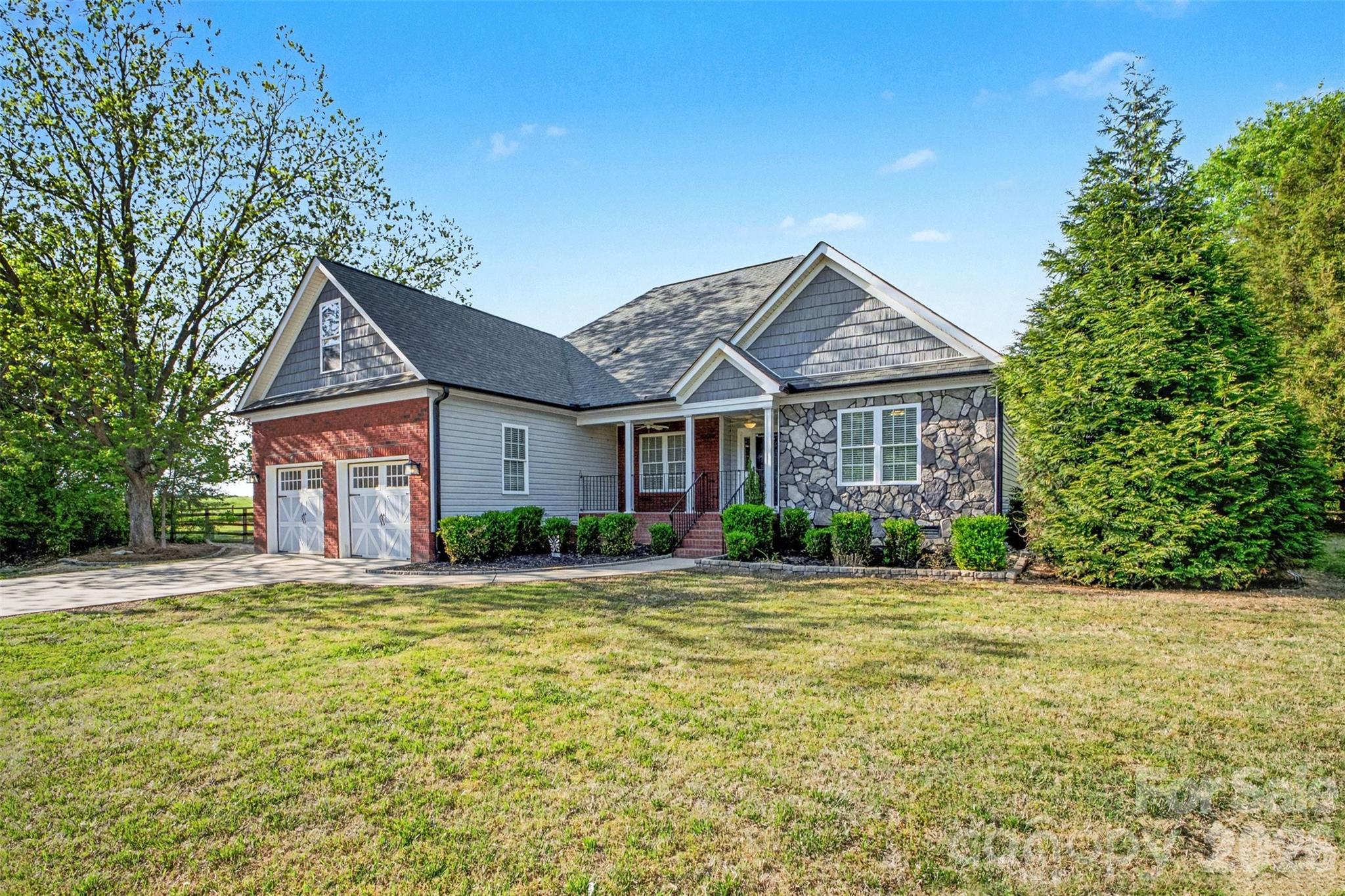 3604 Rilla Hamilton Road Monroe, NC 28110 - Photo 4 of 46 a front view of a house with a yard
