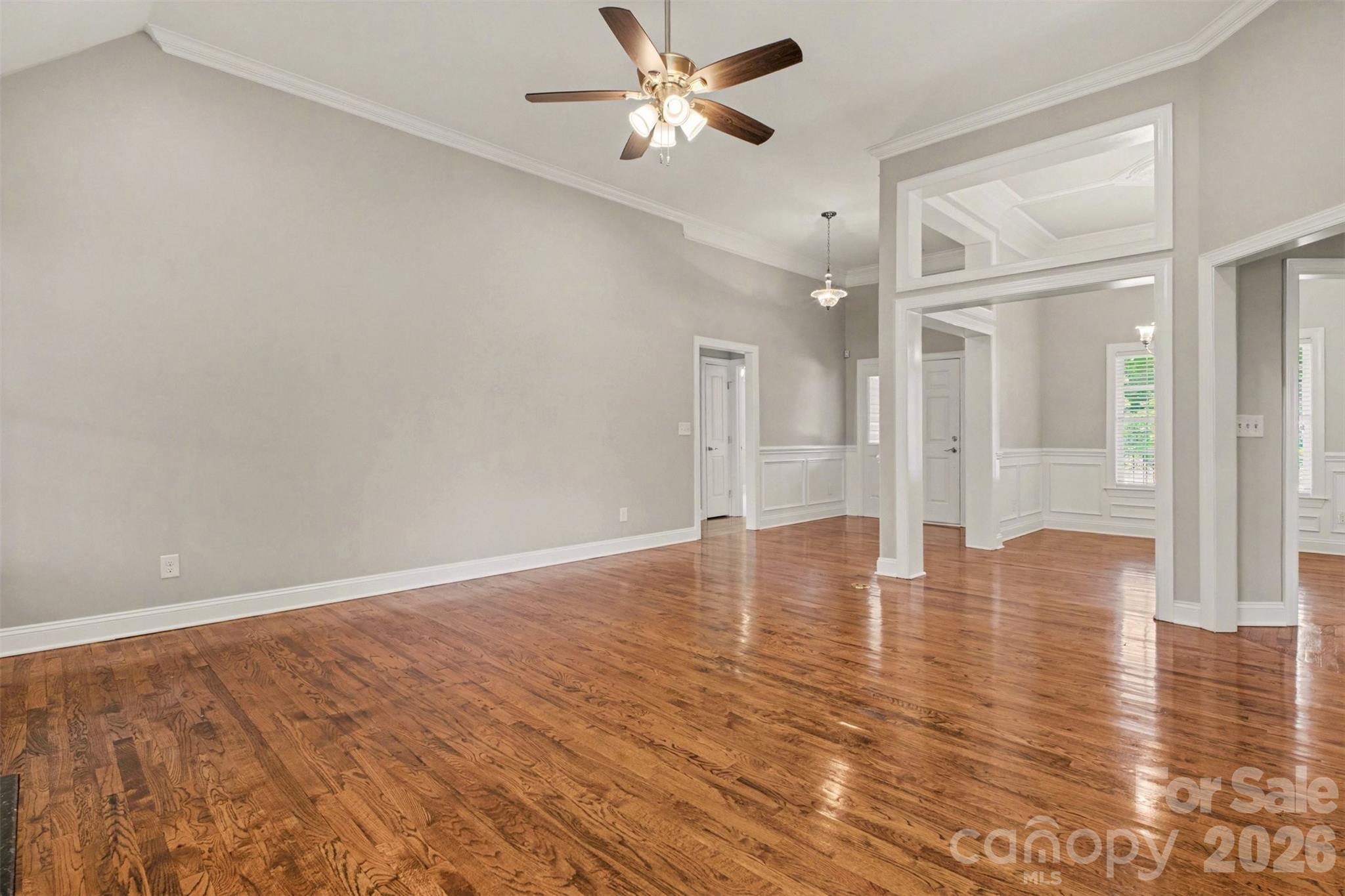 3604 Rilla Hamilton Road Monroe, NC 28110 - Photo 7 of 46 an empty room with wooden floor and windows
