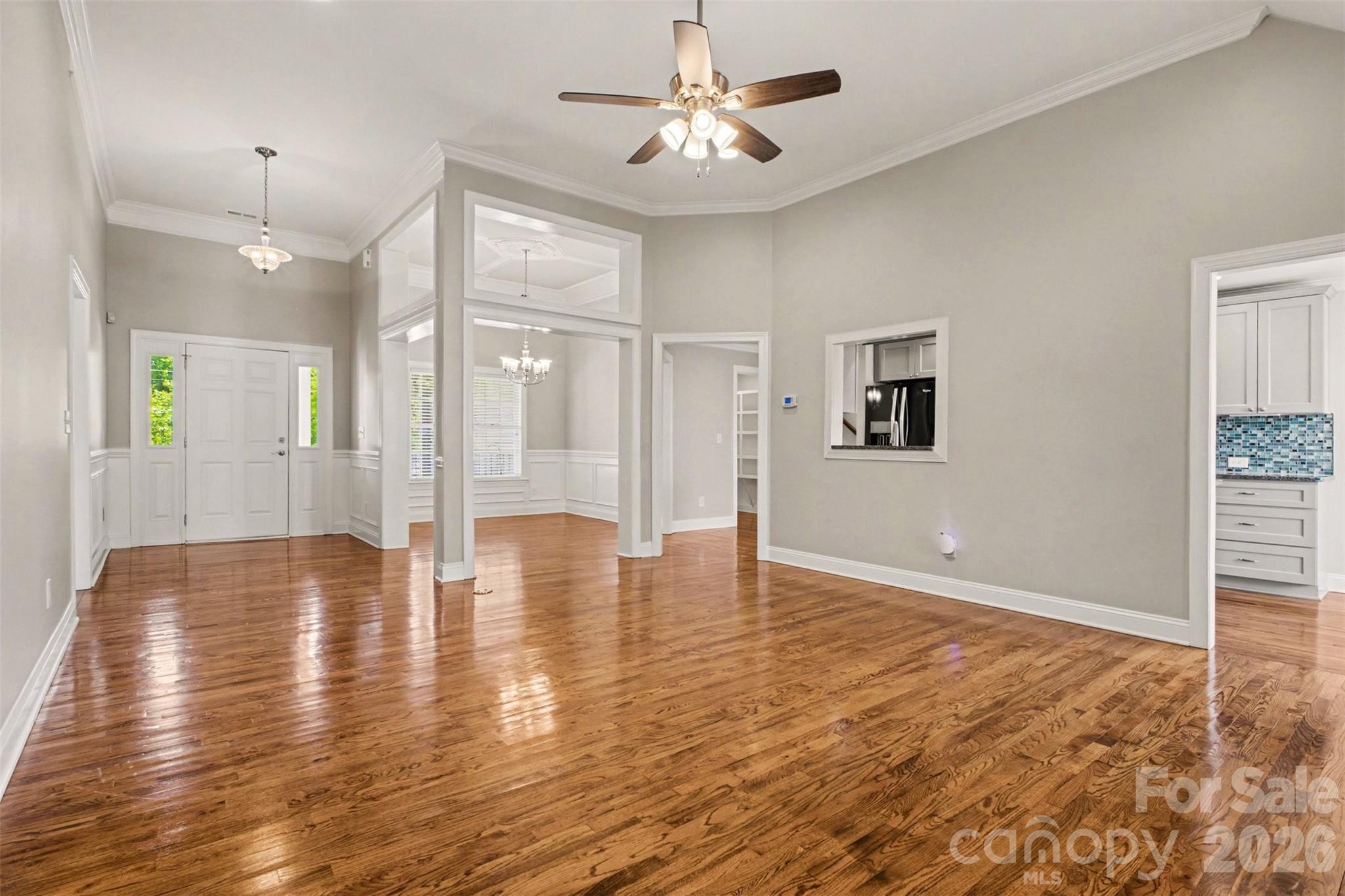 3604 Rilla Hamilton Road Monroe, NC 28110 - Photo 9 of 46 a view of an empty room with window and wooden floor
