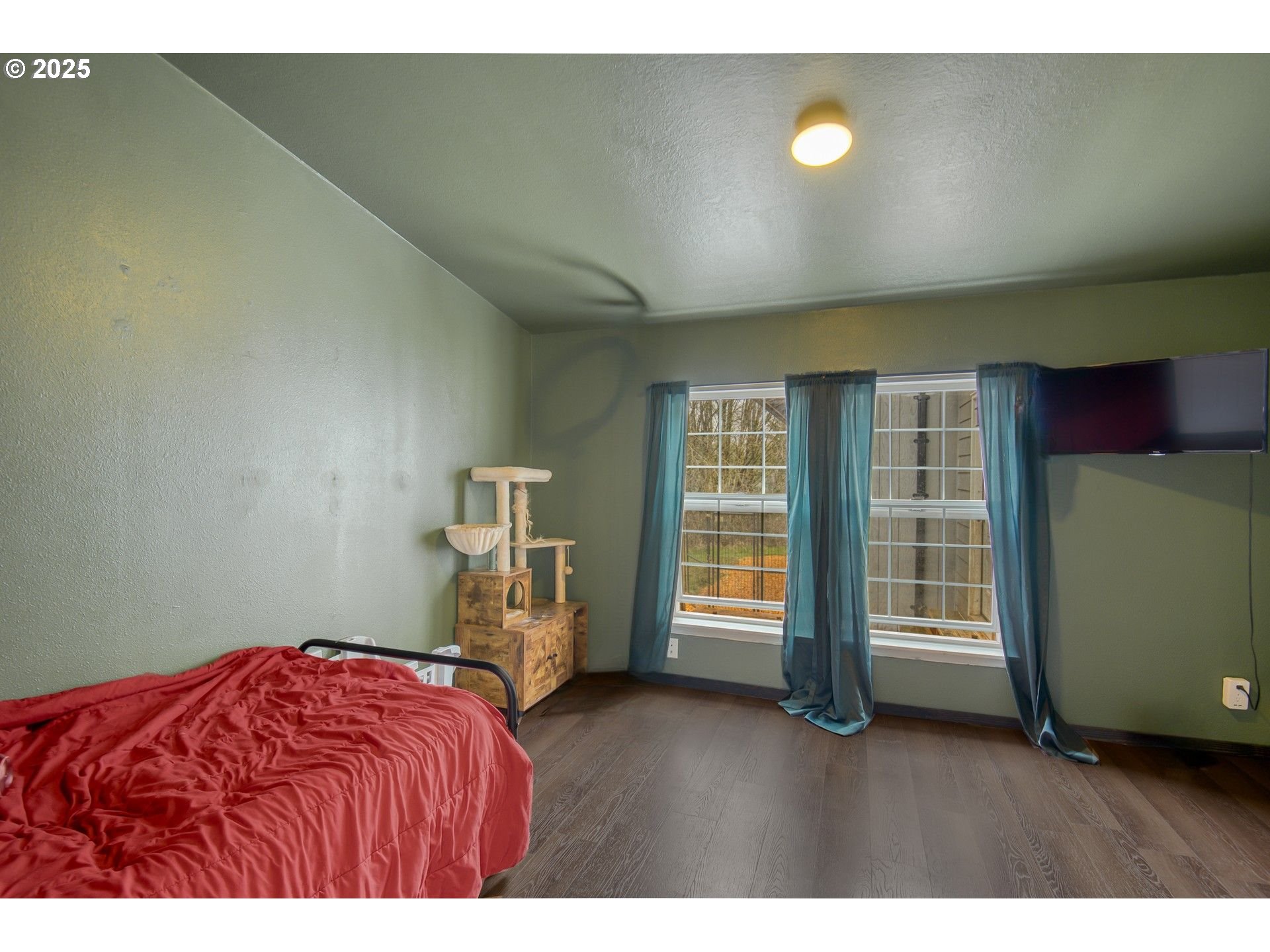 34241 Southeast Colorado Road Sandy, OR 97055 - Photo 16 of 37 a bedroom with a bed and a large window