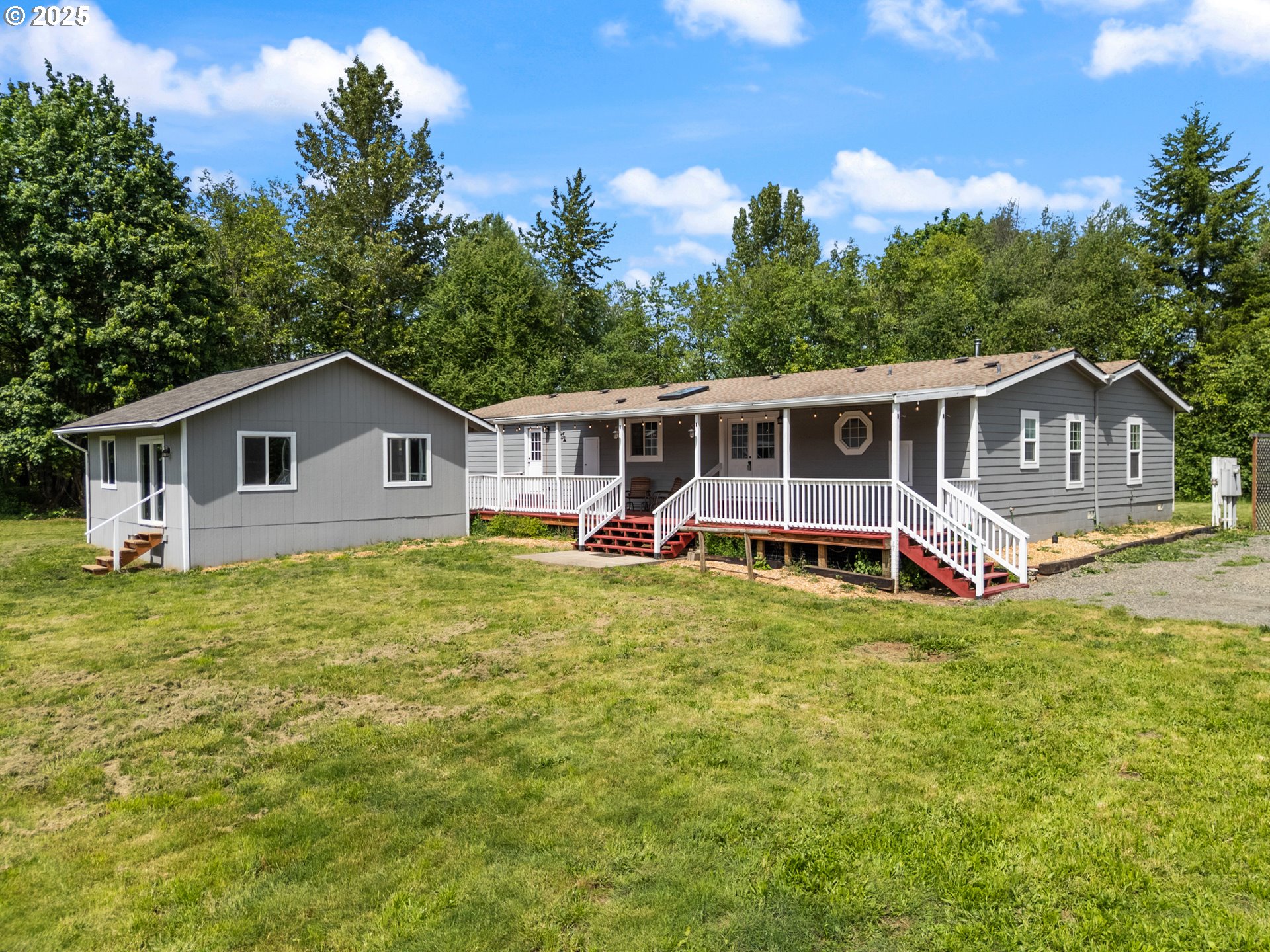 34241 Southeast Colorado Road Sandy, OR 97055 - Photo 32 of 37 a view of a house with wooden deck and furniture