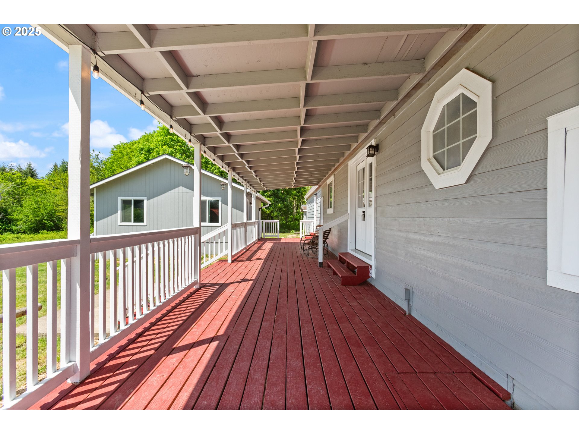 34241 Southeast Colorado Road Sandy, OR 97055 - Photo 33 of 37 a view of a house with wooden deck