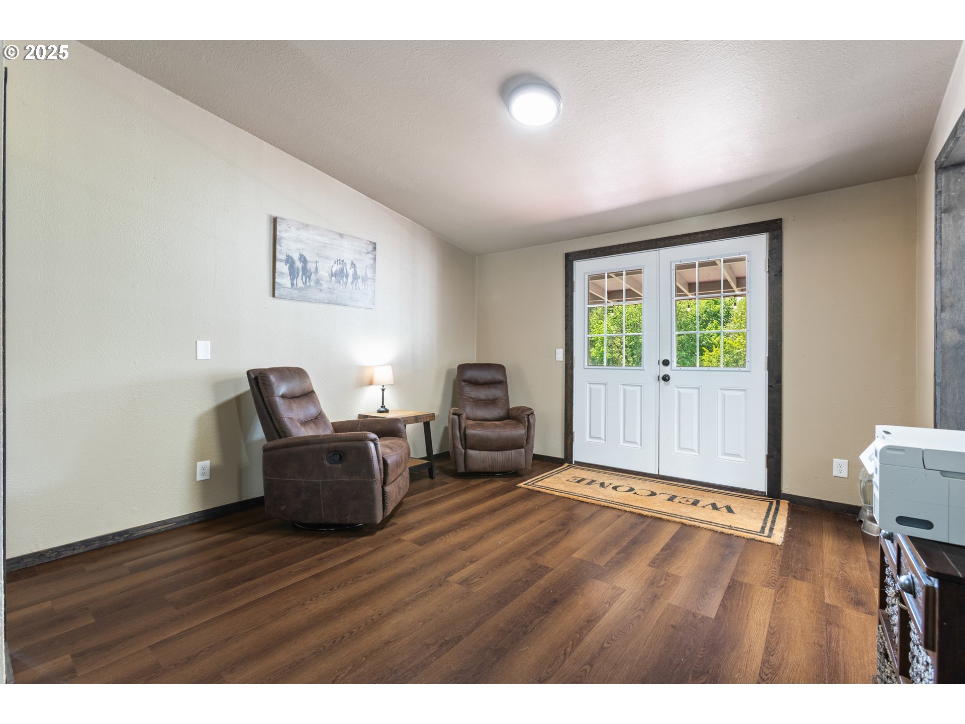 34241 Southeast Colorado Road Sandy, OR 97055 - Photo 34 of 37 a living room with furniture and a wooden floor