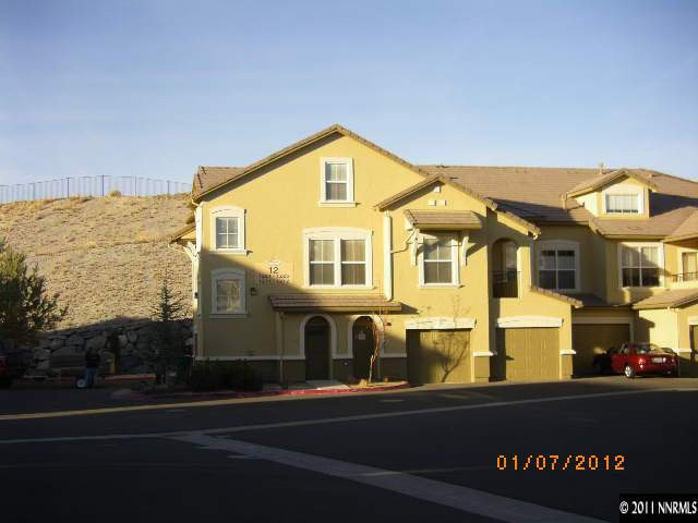 9050 Double R Boulevard, Unit 1224 Reno, NV 89521 - Photo 1 of 8 a view of a house with a swimming pool
