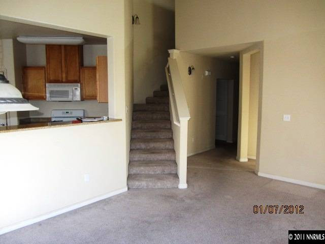 9050 Double R Boulevard, Unit 1224 Reno, NV 89521 - Photo 4 of 8 a view of a kitchen from the hallway