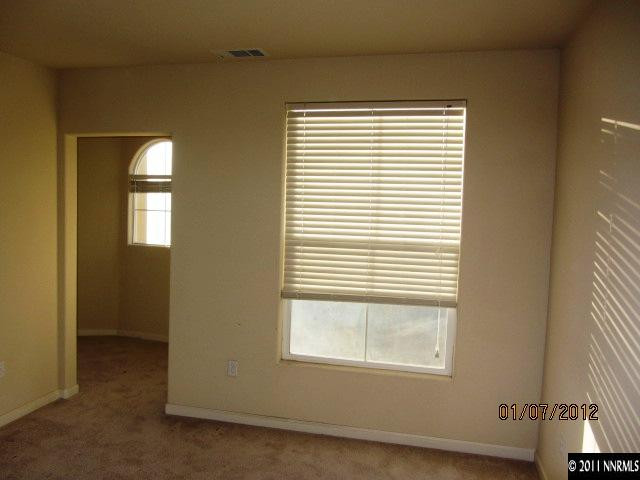 9050 Double R Boulevard, Unit 1224 Reno, NV 89521 - Photo 6 of 8 a view of an empty room with a window