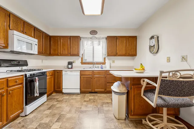 a kitchen with a sink cabinets and stainless steel appliances