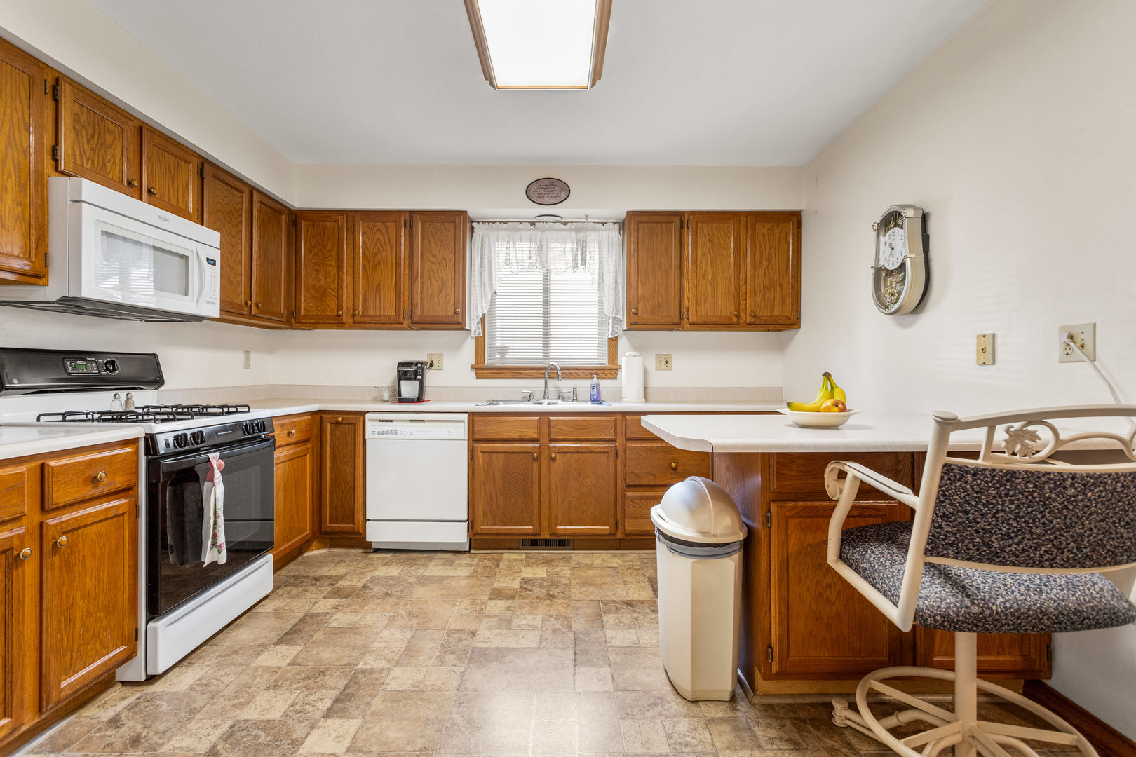 708 East Benham Street Tolono, IL 61880 - Photo 11 of 34 a kitchen with a sink cabinets and stainless steel appliances