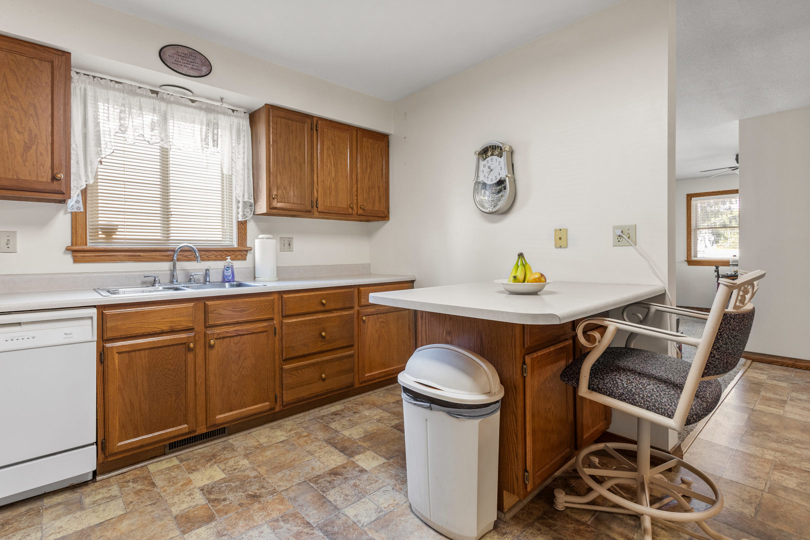 708 East Benham Street Tolono, IL 61880 - Photo 12 of 34 a kitchen with granite countertop a sink stove and white cabinets