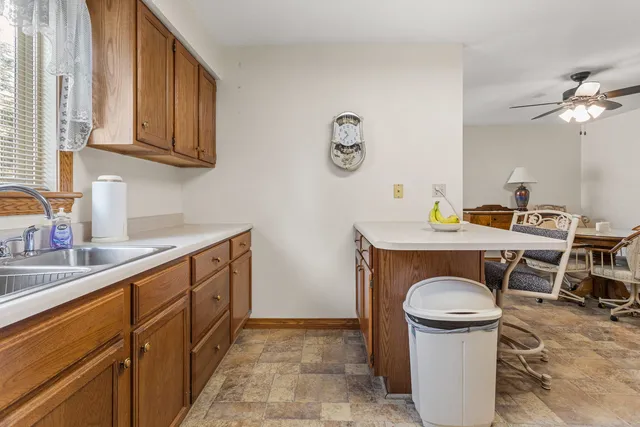 a kitchen with stainless steel appliances granite countertop a sink stove and cabinets