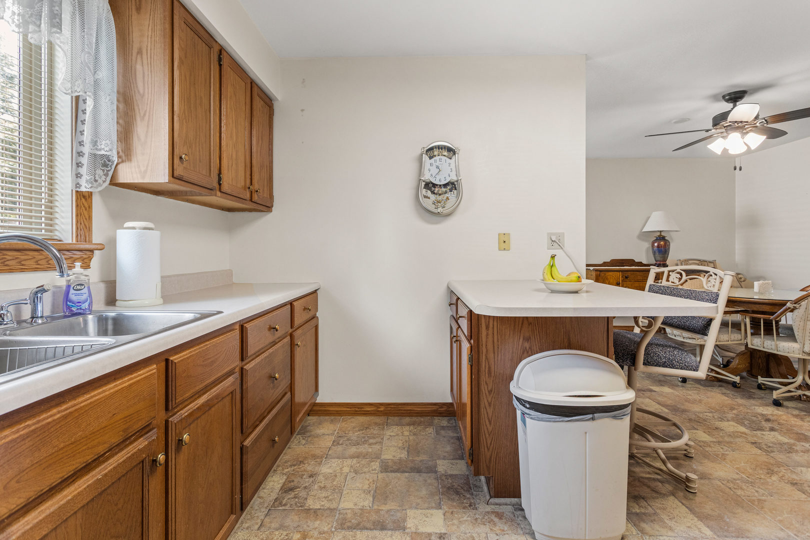 708 East Benham Street Tolono, IL 61880 - Photo 14 of 34 a kitchen with stainless steel appliances granite countertop a sink stove and cabinets