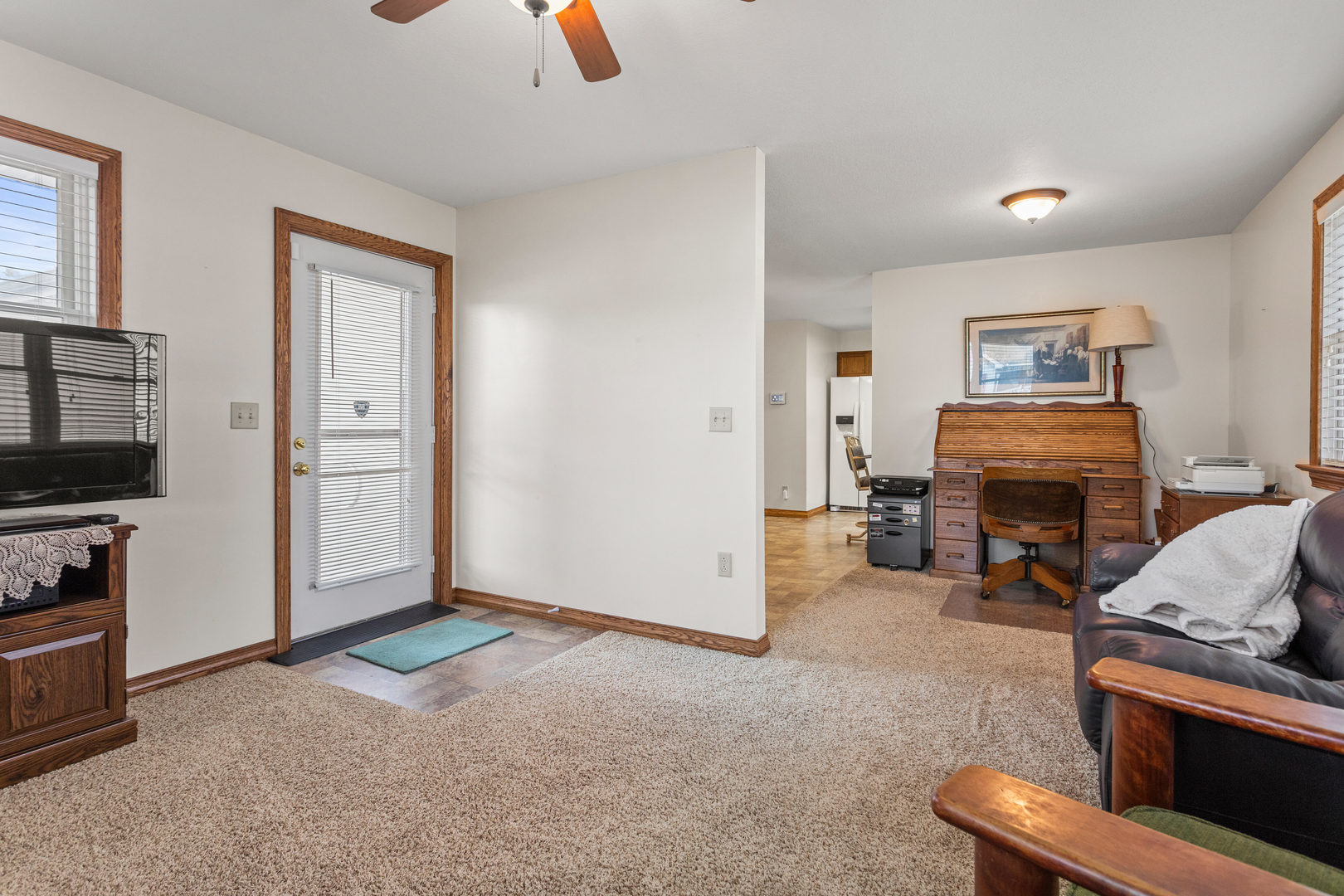708 East Benham Street Tolono, IL 61880 - Photo 16 of 34 a living room with furniture and a fireplace