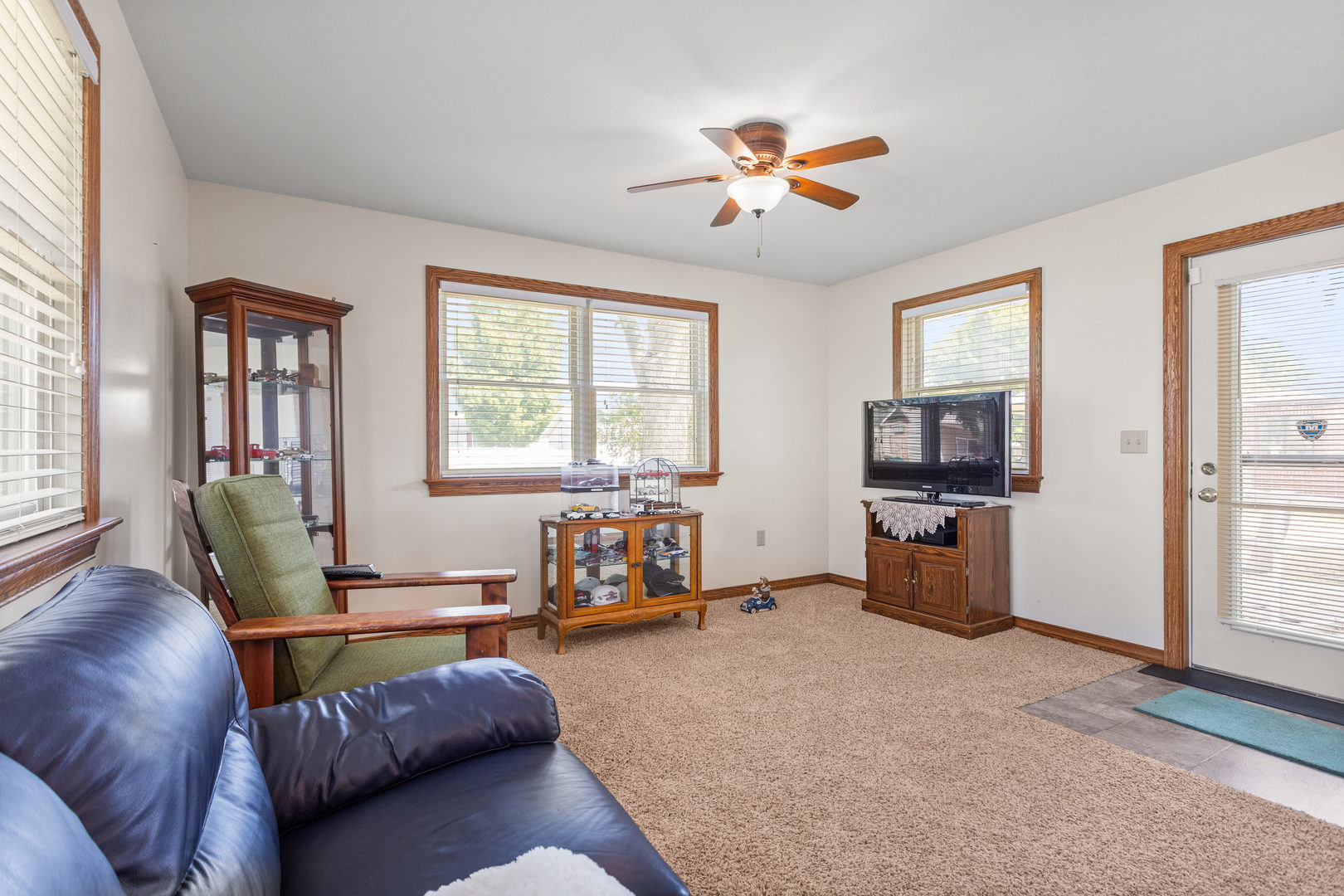 708 East Benham Street Tolono, IL 61880 - Photo 17 of 34 a living room with furniture and a flat screen tv