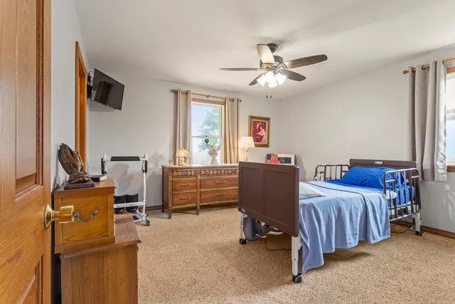 a bedroom with furniture and a window