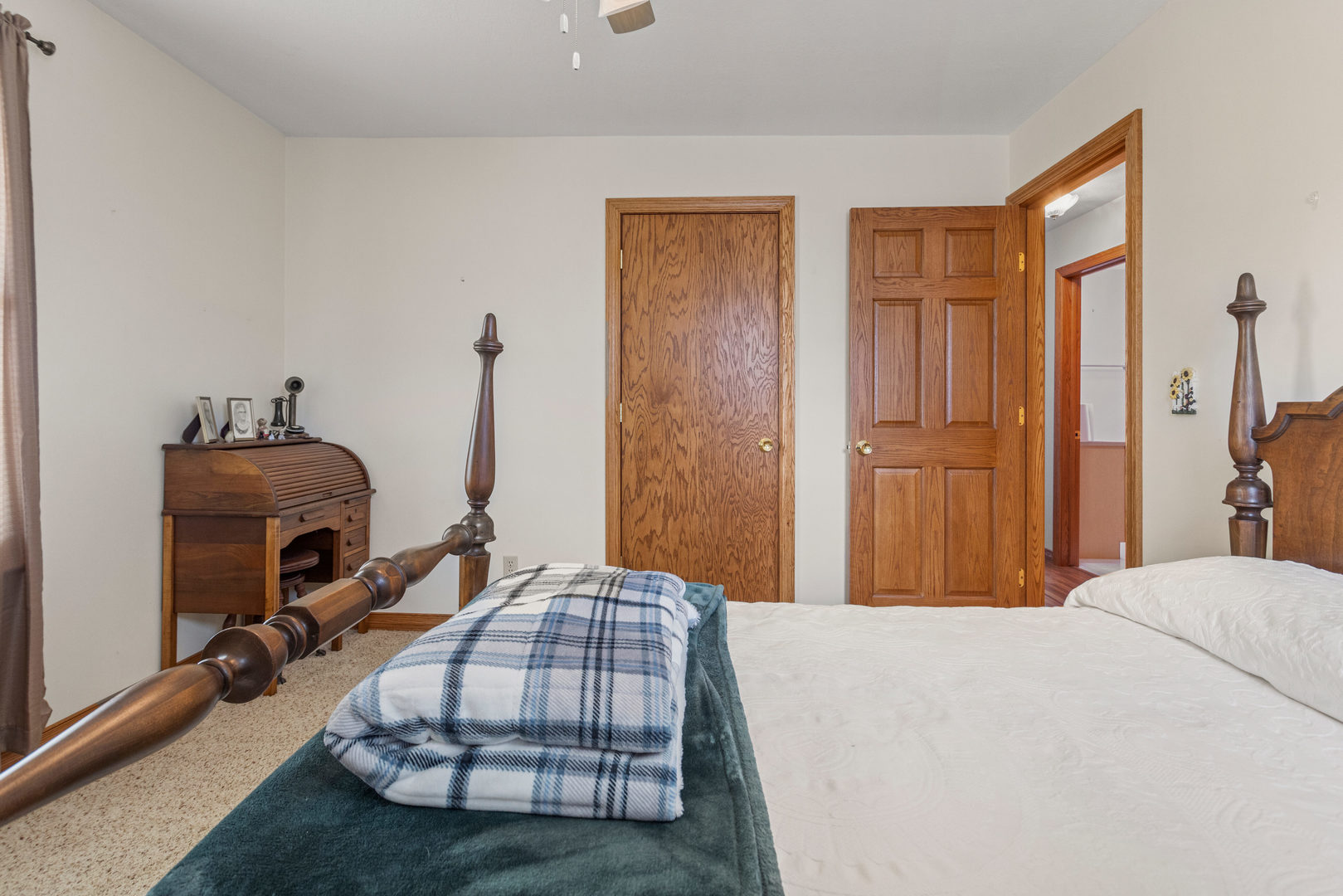 708 East Benham Street Tolono, IL 61880 - Photo 28 of 34 a bedroom with bed and wooden floor