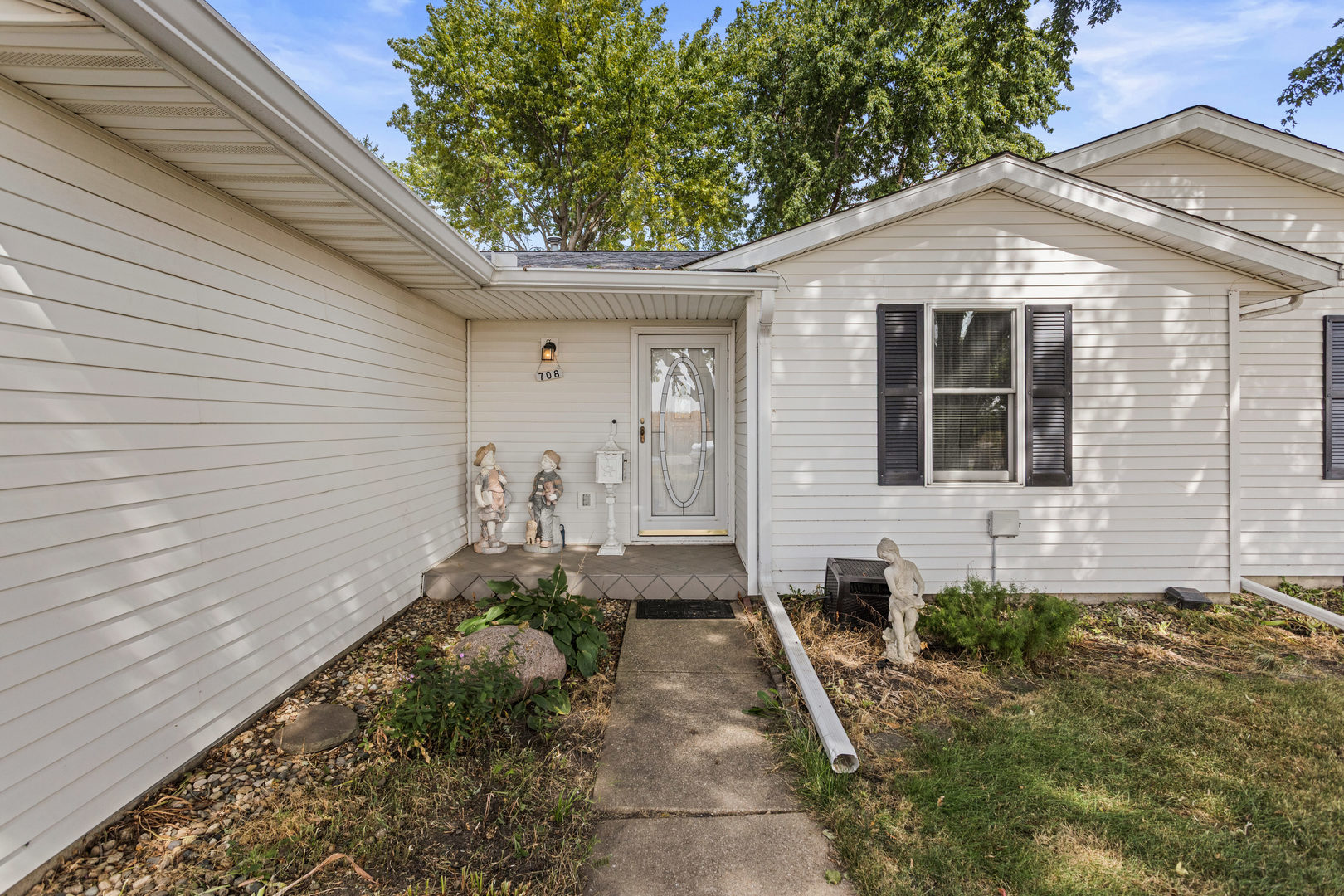 708 East Benham Street Tolono, IL 61880 - Photo 3 of 34 a front view of a house with a yard