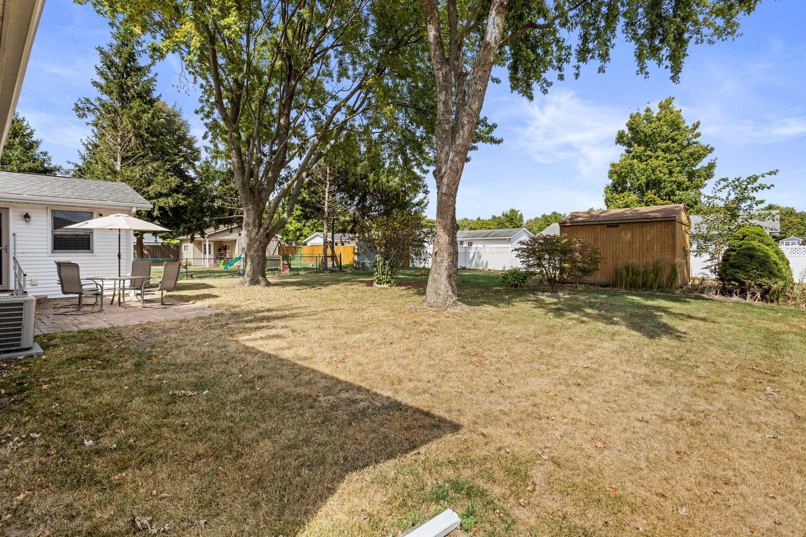 708 East Benham Street Tolono, IL 61880 - Photo 33 of 34 a view of a yard with plants and a trees