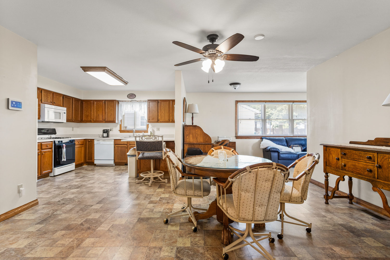 708 East Benham Street Tolono, IL 61880 - Photo 9 of 34 a living room with stainless steel appliances kitchen island granite countertop furniture and a kitchen view
