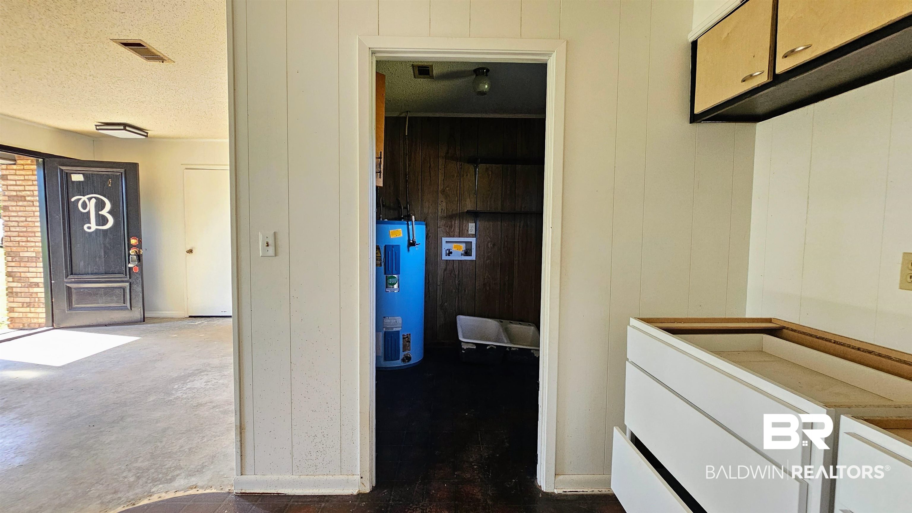 18824 Highway 41 Brewton, AL 36426 - Photo 7 of 40 Interior space featuring white vertical paneling and existing upper and lower cabinetry