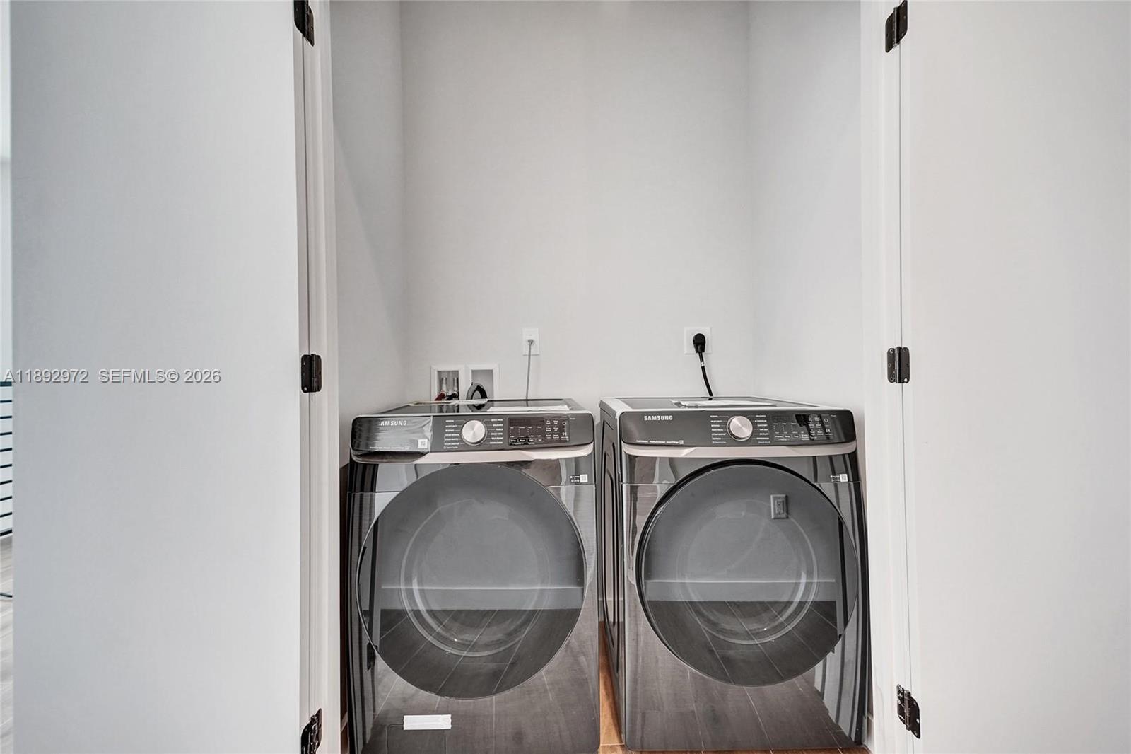525 Northeast 61st Street Miami, FL 33137 - Photo 31 of 37 a utility room with dryer and washer