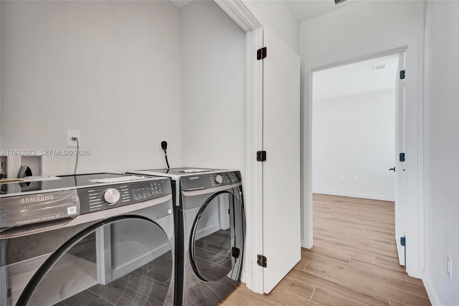 525 Northeast 61st Street Miami, FL 33137 - Photo 32 of 37 a utility room with dryer and washer