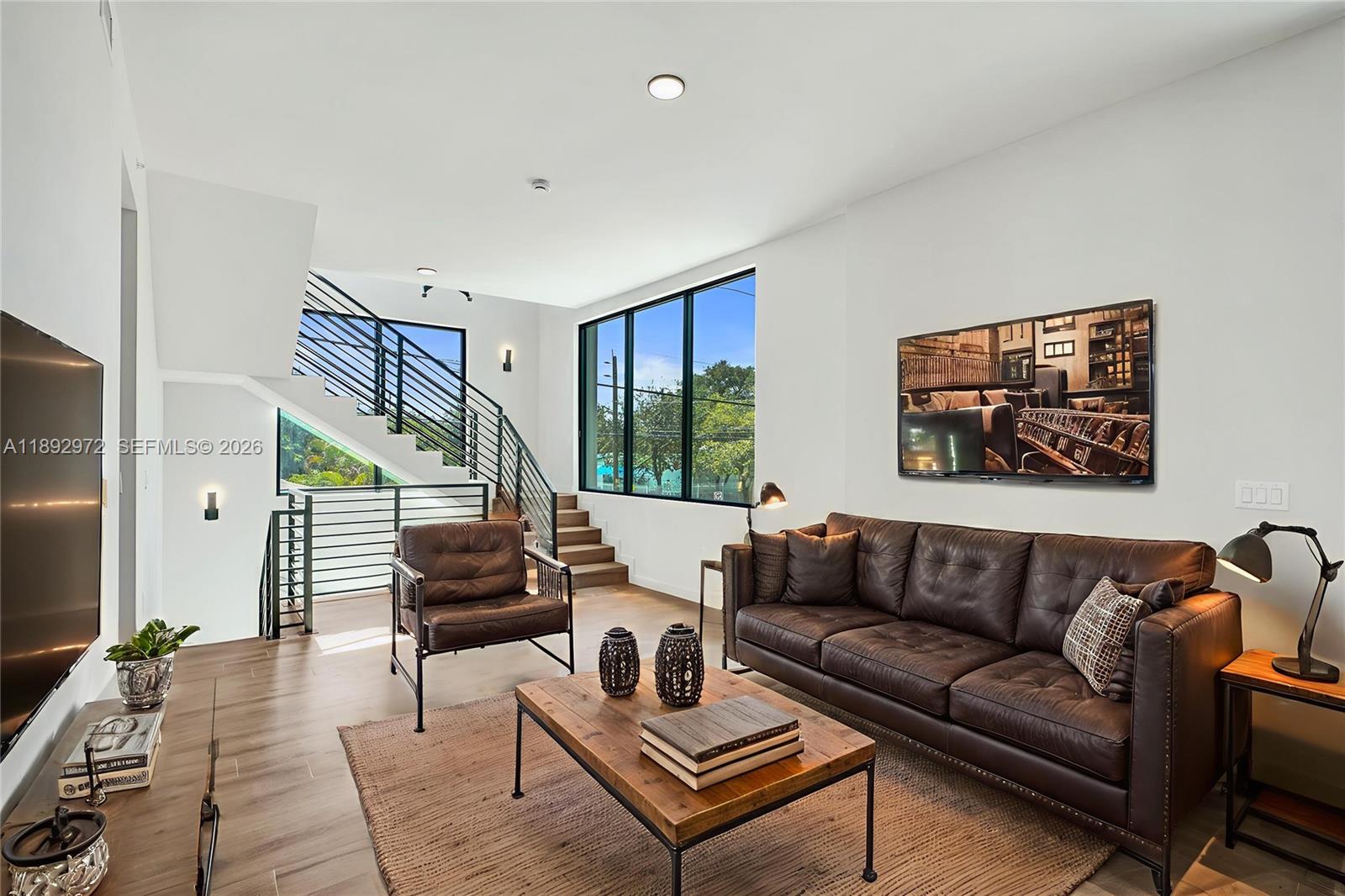 525 Northeast 61st Street Miami, FL 33137 - Photo 7 of 37 a living room with furniture and a potted plant