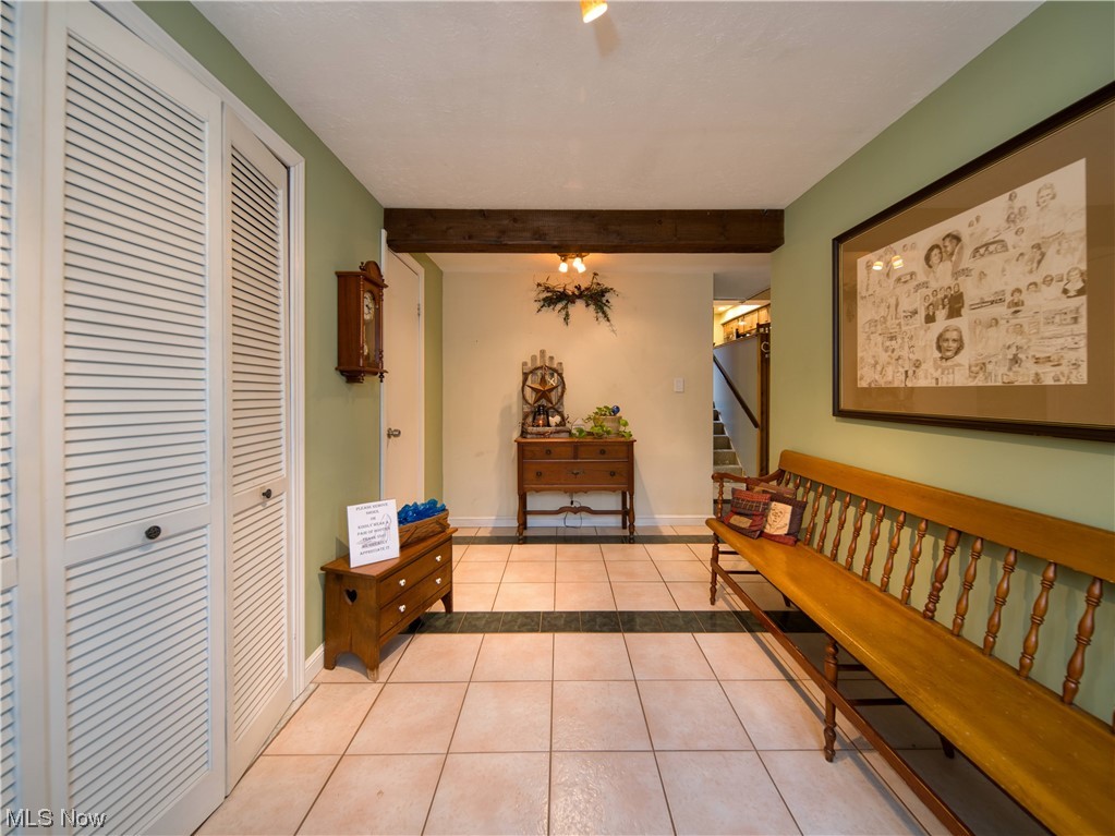 9696 Thwing Road Chardon, OH 44024 - Photo 6 of 35 Tiled entrance foyer featuring beamed ceiling