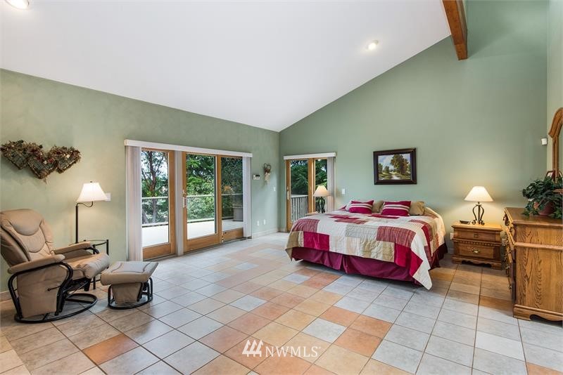 226 Guy Kelly Road Port Angeles, WA 98362 - Photo 14 of 40 a living room with furniture and large windows