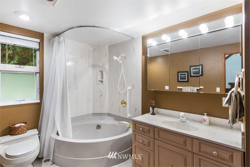 226 Guy Kelly Road Port Angeles, WA 98362 - Photo 15 of 40 a bathroom with a granite countertop sink toilet and shower