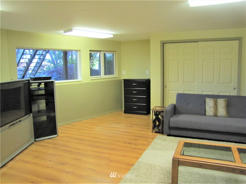 226 Guy Kelly Road Port Angeles, WA 98362 - Photo 16 of 40 a living room with furniture and a flat screen tv