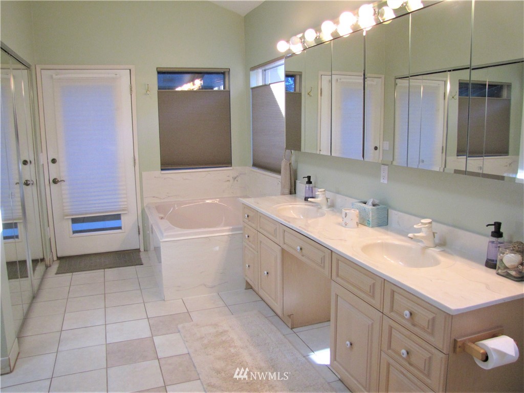 226 Guy Kelly Road Port Angeles, WA 98362 - Photo 18 of 40 a bathroom with a sink double vanity and a mirror