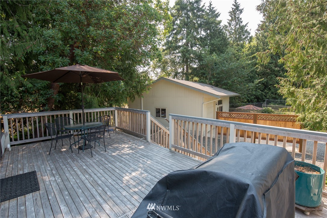 226 Guy Kelly Road Port Angeles, WA 98362 - Photo 23 of 40 a view of a deck with two chair and a table