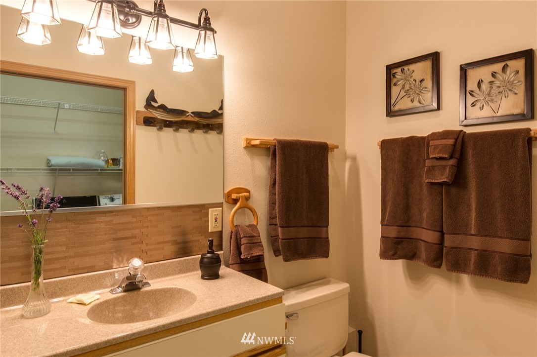226 Guy Kelly Road Port Angeles, WA 98362 - Photo 29 of 40 a bathroom with a sink and a mirror