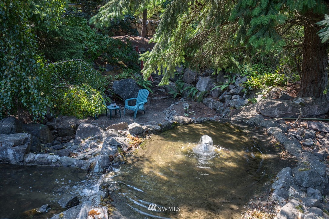 226 Guy Kelly Road Port Angeles, WA 98362 - Photo 34 of 40 a backyard of a house with lots of green space