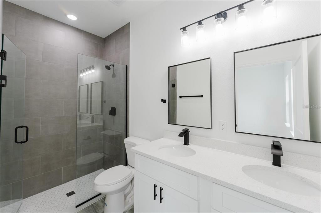 6732 Southwest 132nd Street Ocala, FL 34473 - Photo 27 of 36 a bathroom with a sink toilet and shower