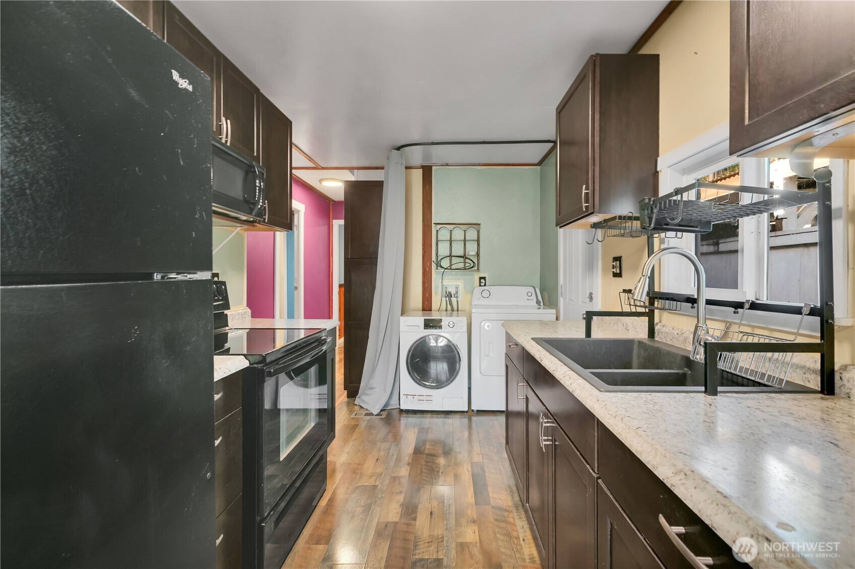 7311 Chambers Creek Road West, Unit 37 University Place, WA 98467 - Photo 11 of 23 a kitchen with stainless steel appliances granite countertop a sink and a refrigerator