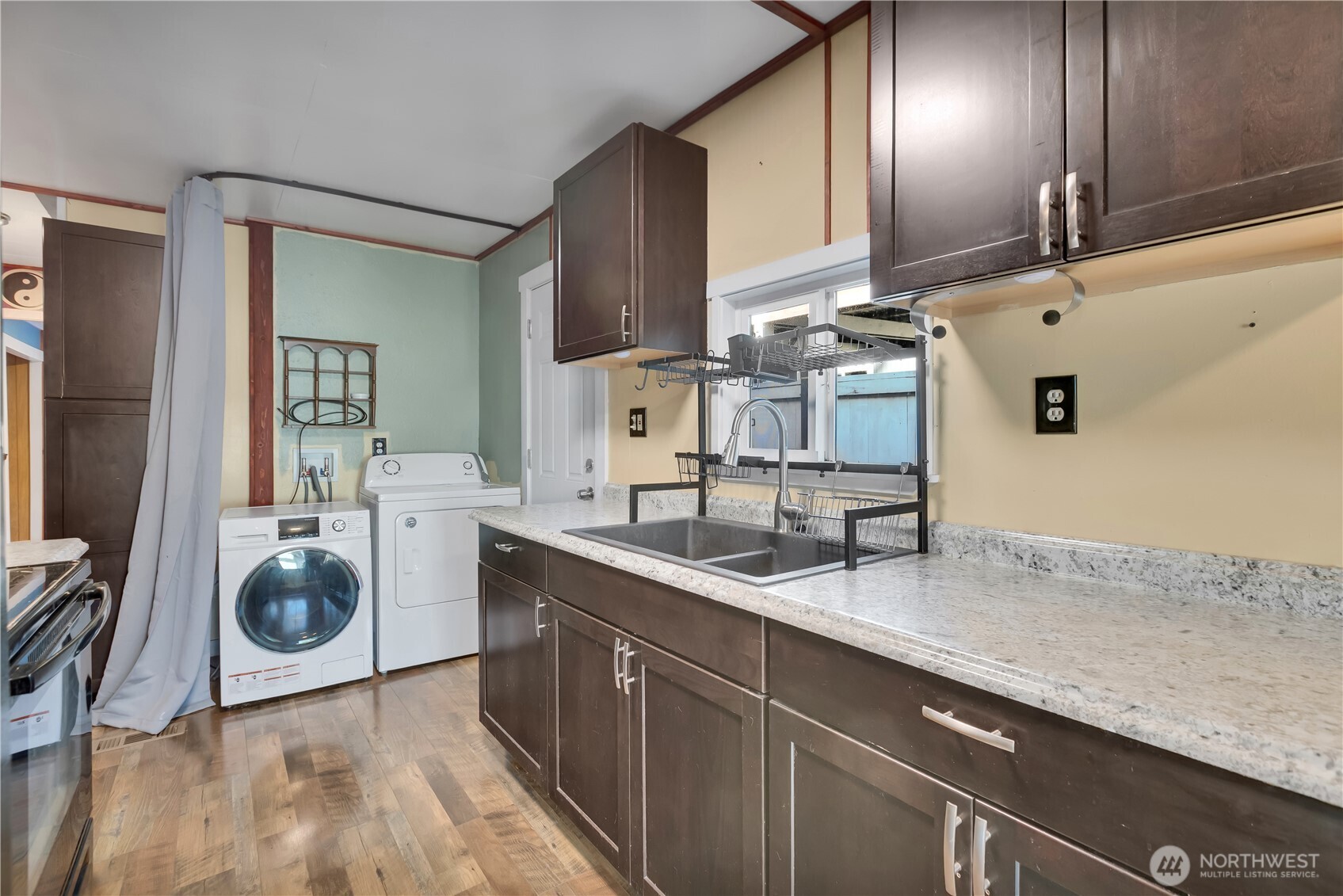 7311 Chambers Creek Road West, Unit 37 University Place, WA 98467 - Photo 13 of 23 a kitchen with a sink and cabinets