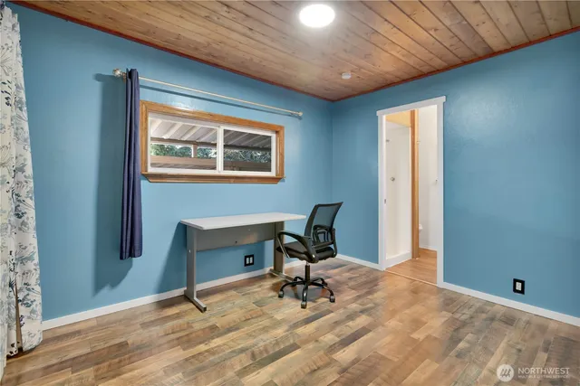 a workspace with furniture and a window