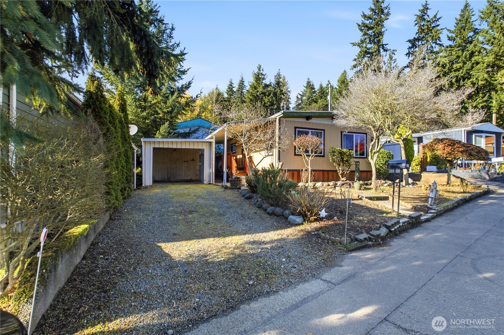 7311 Chambers Creek Road West, Unit 37 University Place, WA 98467 - Photo 23 of 23 a view of a house with a yard