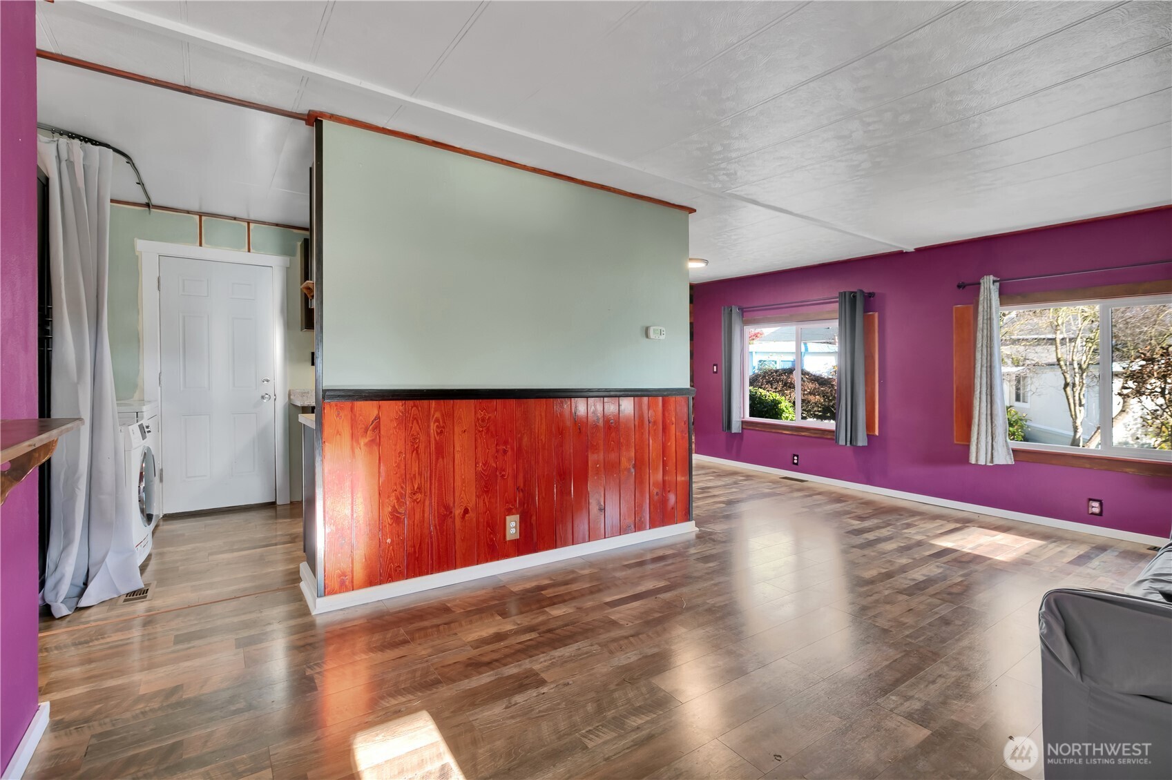 7311 Chambers Creek Road West, Unit 37 University Place, WA 98467 - Photo 7 of 23 a view of a room with wooden floor and windows