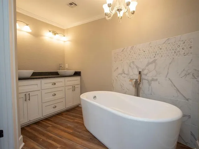 a white bath tub sitting in a bathroom