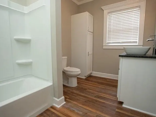 a bathroom with a sink and a bathtub